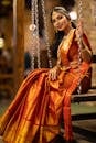 pexels photo 27575174 27575174 Beautiful woman in a traditional saree with gold jewelry, exuding elegance.